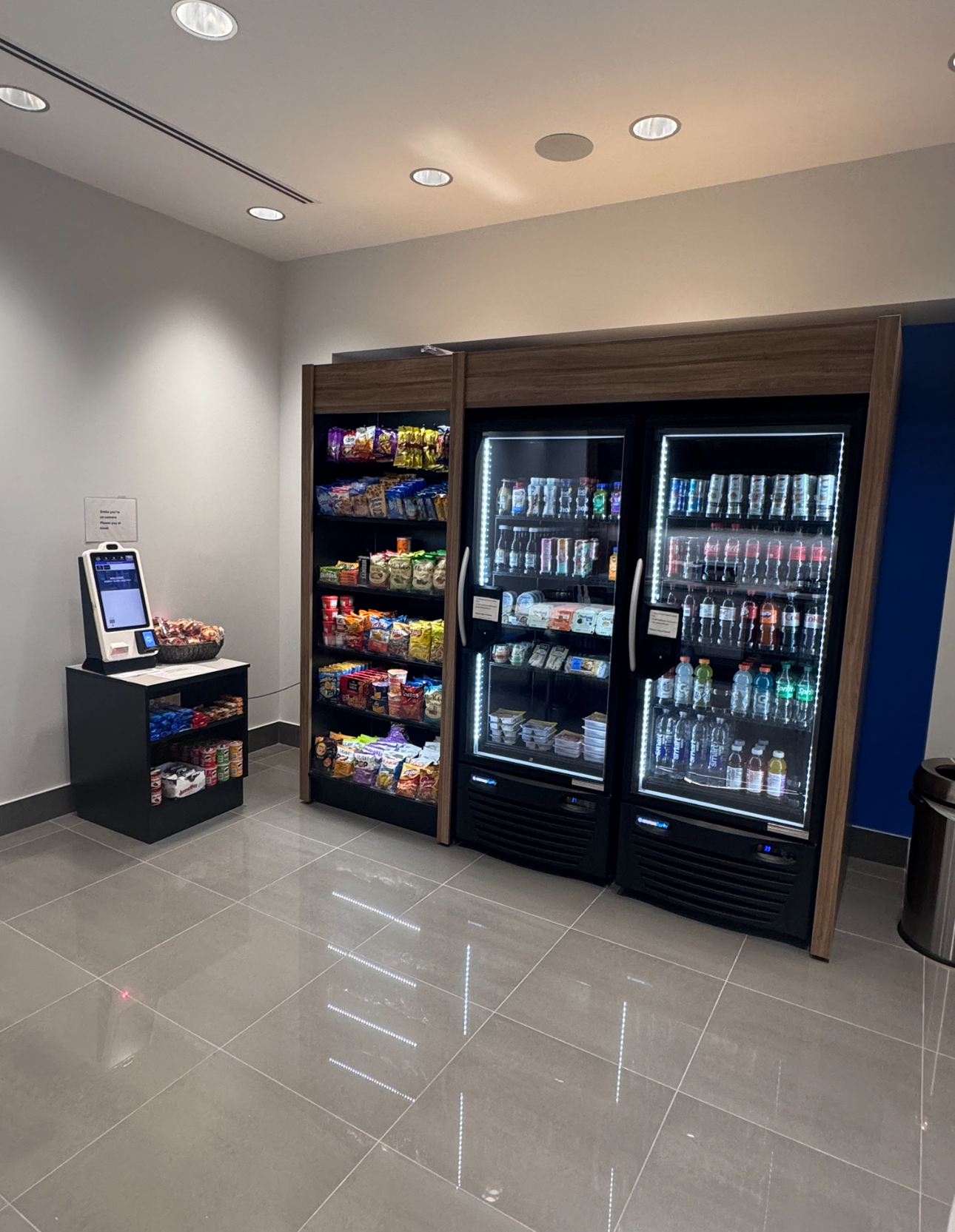 Smart market setup with self-checkout kiosk and refrigerated display