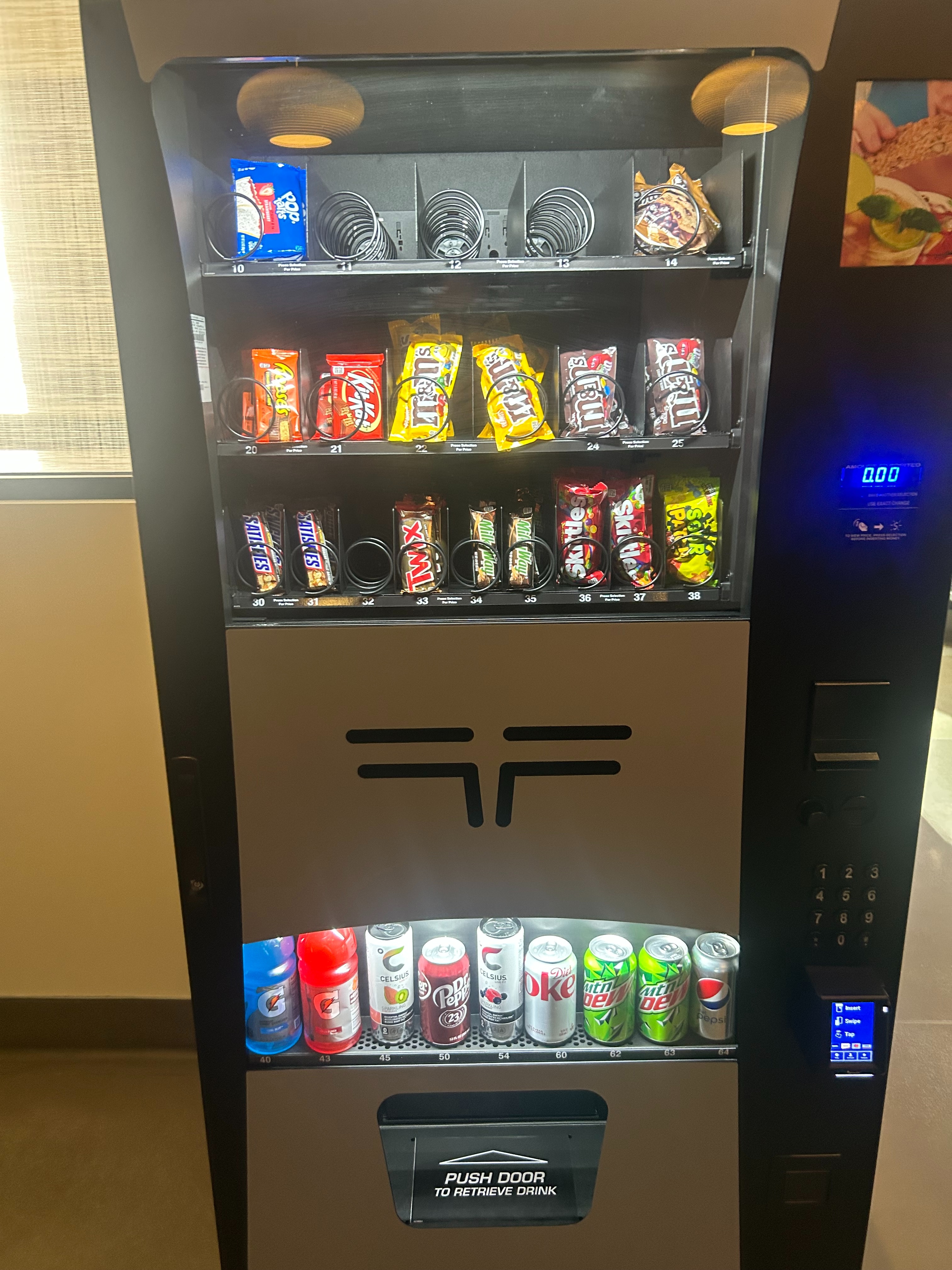 Dual-door smart cooler stocked with snacks and drinks